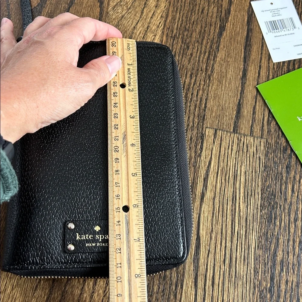 Black leather Kate Spade Wellesley zip around personal organizer/planner